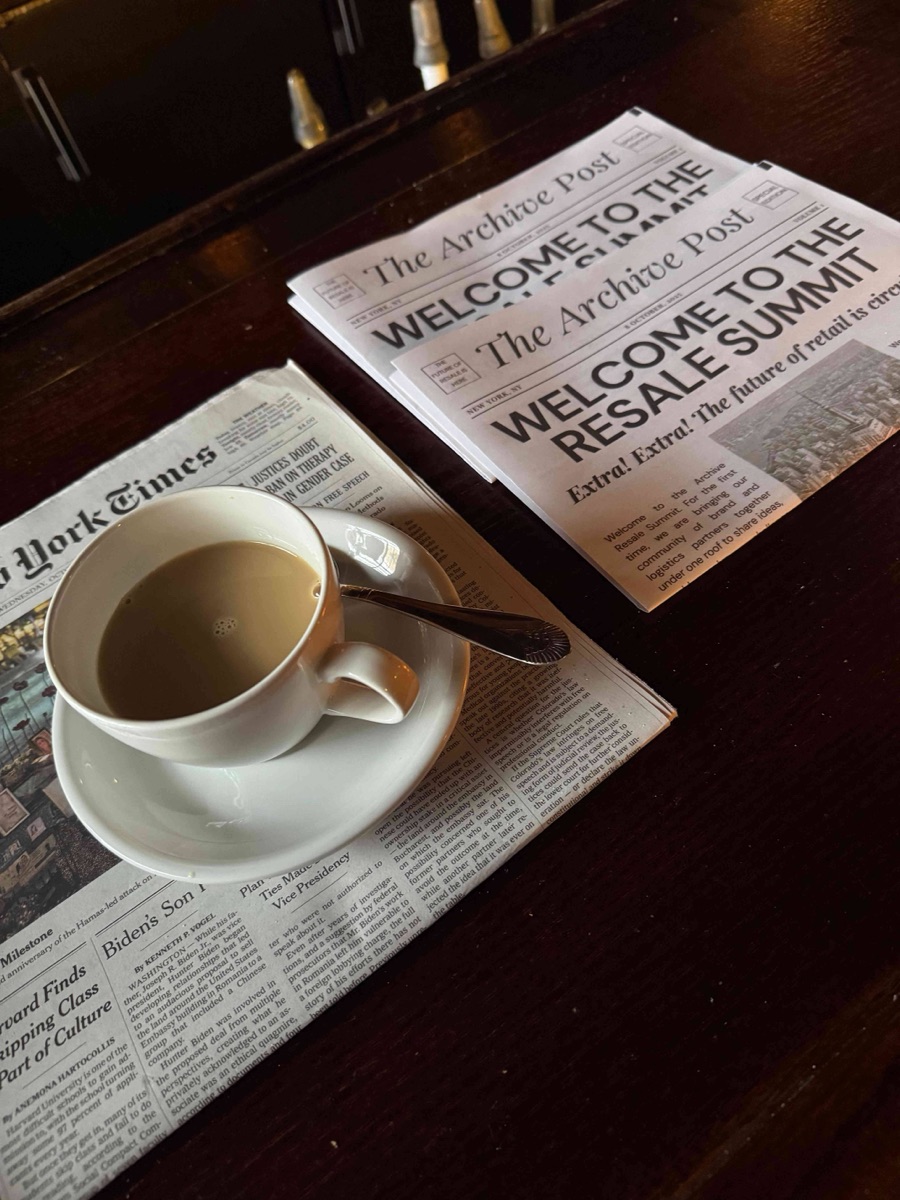 A welcome card and coffee on a table